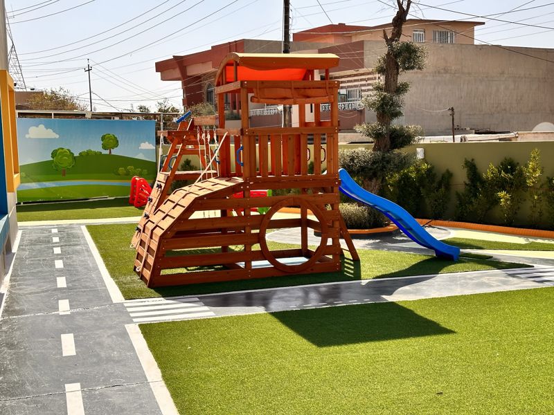 Play yard with a mini road and lane markings